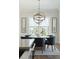 Sunlit dining area with modern chandelier and comfortable seating, perfect for Gathering meals and gatherings at 1537 Tomato Farm Cir, Mount Pleasant, SC 29464