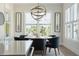 Bright dining room with decorative lighting fixture and natural light, creating an inviting atmosphere at 1537 Tomato Farm Cir, Mount Pleasant, SC 29464