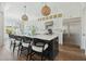 Gourmet kitchen with stainless steel appliances, island with seating, and modern pendant lights at 1537 Tomato Farm Cir, Mount Pleasant, SC 29464