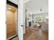 Open-concept living space with hardwood floors, an elevator, and natural light and fireplace at 1537 Tomato Farm Cir, Mount Pleasant, SC 29464