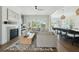 Open-concept living room with a fireplace, neutral color palette, and seamless kitchen access at 1537 Tomato Farm Cir, Mount Pleasant, SC 29464