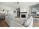 Bright living room featuring a fireplace, modern ceiling fan, and stylish decor at 1537 Tomato Farm Cir, Mount Pleasant, SC 29464