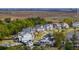 Picturesque view of a serene neighborhood with well-maintained homes, lush greenery, and a tranquil lake, offering a peaceful lifestyle at 1537 Tomato Farm Cir, Mount Pleasant, SC 29464