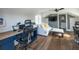 Well-lit home office with hardwood floors, a cozy seating area, and an attached bathroom at 1537 Tomato Farm Cir, Mount Pleasant, SC 29464