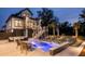 Inviting backyard oasis featuring a sparkling pool, comfortable seating, and lush landscaping, creating a perfect outdoor retreat at 1537 Tomato Farm Cir, Mount Pleasant, SC 29464
