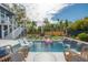 Beautiful pool with waterfall feature, lounge chairs, and lush landscaping for relaxation at 1537 Tomato Farm Cir, Mount Pleasant, SC 29464