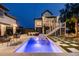 Stunning backyard pool area with modern outdoor furniture and manicured landscaping at 1537 Tomato Farm Cir, Mount Pleasant, SC 29464