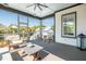 Relaxing screened porch featuring comfortable seating and views of the surrounding landscape at 1537 Tomato Farm Cir, Mount Pleasant, SC 29464
