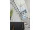 Bright staircase features modern railing, light hardwood steps, shiplap walls, and coastal decor at 1537 Tomato Farm Cir, Mount Pleasant, SC 29464