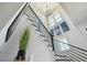 Bright staircase features modern railing, light hardwood steps, shiplap walls, and coastal decor at 1537 Tomato Farm Cir, Mount Pleasant, SC 29464