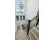 View from the top of the staircase featuring light hardwood steps and modern railing at 1537 Tomato Farm Cir, Mount Pleasant, SC 29464