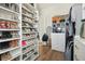 Well-organized walk-in closet showcasing custom shelves, and hardwood floors at 1537 Tomato Farm Cir, Mount Pleasant, SC 29464