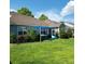 Spacious backyard featuring a hot tub area with a shade sail, offering a serene outdoor living space at 169 Woodbrook Way, Moncks Corner, SC 29461