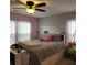Cozy bedroom with a ceiling fan and natural light coming through the window at 169 Woodbrook Way, Moncks Corner, SC 29461