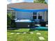 Backyard hot tub features a blue shade and string lights, perfect for outdoor relaxation and entertaining at 169 Woodbrook Way, Moncks Corner, SC 29461