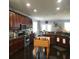Spacious kitchen features dark wood cabinets and stainless steel appliances at 169 Woodbrook Way, Moncks Corner, SC 29461