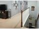 Upstairs landing with staircase, carpeted floors, and open view of downstairs rooms at 169 Woodbrook Way, Moncks Corner, SC 29461