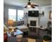 Inviting living room features a cozy fireplace, ceiling fan, and abundant natural light at 169 Woodbrook Way, Moncks Corner, SC 29461