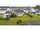 Aerial view of a home, showing the backyard with a patio and a fence, plus a nearby pond at 1740 Agate Bay Dr, Mount Pleasant, SC 29466