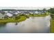 Aerial view of homes bordering a pond, showcasing well-manicured lawns and neighborhood layout at 1740 Agate Bay Dr, Mount Pleasant, SC 29466