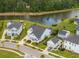 Aerial view of a residential neighborhood with ponds, mature trees, and well-maintained landscaping at 1740 Agate Bay Dr, Mount Pleasant, SC 29466