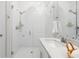 Bright bathroom with a glass walk-in shower and a sink with quartz countertop and chrome hardware at 1740 Agate Bay Dr, Mount Pleasant, SC 29466