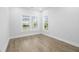 Bedroom featuring hardwood floors and a bright view from two windows at 1740 Agate Bay Dr, Mount Pleasant, SC 29466