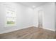 Bright bedroom with hardwood floors and a view of the outside through a window at 1740 Agate Bay Dr, Mount Pleasant, SC 29466
