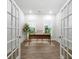 Bright home office with wood floors, a modern desk, french doors and a neutral color scheme at 1740 Agate Bay Dr, Mount Pleasant, SC 29466