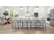 Modern kitchen with white chairs, a marble countertop, and stainless steel appliances at 1740 Agate Bay Dr, Mount Pleasant, SC 29466