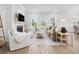 Comfortable living room featuring a fireplace, ample seating, and large windows for natural light at 1740 Agate Bay Dr, Mount Pleasant, SC 29466