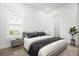 Bedroom features a gray bed with accent pillows, a side table, and a plant near the opening at 1740 Agate Bay Dr, Mount Pleasant, SC 29466