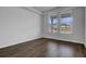 Empty bedroom with wood floors, double windows, and electrical outlets at 199 Belfort Pl, Summerville, SC 29486