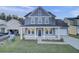 Charming two-story home with a covered front porch and well-maintained landscaping at 199 Belfort Pl, Summerville, SC 29486