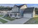 Beautiful two-story home with a covered porch, attached garage, and a lush green lawn at 199 Belfort Pl, Summerville, SC 29486