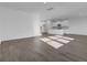 Living room with hardwood floors and light shining through the windows next to the kitchen at 199 Belfort Pl, Summerville, SC 29486