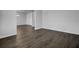Empty living room featuring wood flooring and views to the dining room and entry at 199 Belfort Pl, Summerville, SC 29486