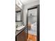 Bathroom featuring modern fixtures, and an open doorway to a bedroom at 2 Francis St # H, Charleston, SC 29403