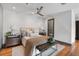 Comfortable bedroom with hardwood floors, ceiling fan, and neutral décor at 2 Francis St # H, Charleston, SC 29403