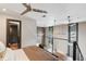 Bedroom with hardwood floors, ceiling fan, and balcony access at 2 Francis St # H, Charleston, SC 29403