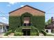 Unique brick building with abundant ivy, and wrought iron details on the exterior at 2 Francis St # H, Charleston, SC 29403