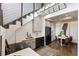 Eat-in kitchen with stainless steel appliances, modern cabinets, and a stylish light fixture at 2 Francis St # H, Charleston, SC 29403