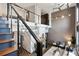 Spacious living room featuring a modern fireplace, hardwood floors, and exposed beams at 2 Francis St # H, Charleston, SC 29403