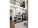 Cozy living room featuring a modern fireplace, high ceilings, and polished concrete floors at 2 Francis St # H, Charleston, SC 29403