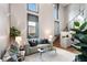 Bright living room featuring high ceilings, modern furnishings, and a cozy atmosphere at 2 Francis St # H, Charleston, SC 29403