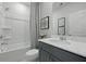 Clean bathroom featuring a tub, shower, gray vanity, and a single sink with quartz countertop at 207 Somerset Acres Dr, Summerville, SC 29486