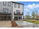Contemporary townhomes featuring garages, balconies, gray and white siding, with designated parking at 207 Somerset Acres Dr, Summerville, SC 29486