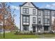 Stylish townhomes featuring gray and white exteriors, complemented by a neatly landscaped lawn at 207 Somerset Acres Dr, Summerville, SC 29486