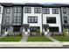 Attractive townhomes featuring a mix of gray and white siding, complemented by neatly kept lawns at 207 Somerset Acres Dr, Summerville, SC 29486