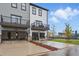 Attractive townhomes with balconies and garages, featuring gray and white exteriors, and accessible parking at 207 Somerset Acres Dr, Summerville, SC 29486